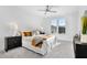 Bright bedroom with a neutral color scheme, large windows providing ample natural light, and modern ceiling fan at 2333 E Main St, Durham, NC 27703