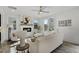 Bright living room featuring a white fireplace, neutral paint and floors, and lots of natural light at 2333 E Main St, Durham, NC 27703