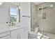 Modern bathroom with glass shower, new fixtures, and natural light at 2337 E Main St, Durham, NC 27703