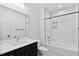 Modern bathroom featuring a vanity, bathtub with stylish tiling, and sleek fixtures at 2337 E Main St, Durham, NC 27703
