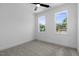 Bright bedroom with two windows and neutral carpet, providing a calm and inviting space at 2337 E Main St, Durham, NC 27703