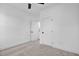 Neutral-toned bedroom with a fan, closet, and carpet floors, offering a simple and comfortable space at 2337 E Main St, Durham, NC 27703