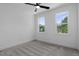 Well-lit bedroom with two windows and neutral carpet, providing a calm and inviting space at 2337 E Main St, Durham, NC 27703
