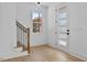 Bright entryway with modern door, new staircase and wood-look floors at 2337 E Main St, Durham, NC 27703