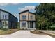 Two-story home with a modern design, featuring neutral siding and a well-manicured front yard at 2337 E Main St, Durham, NC 27703