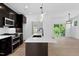 Open-concept kitchen flows to the light-filled living area, showcasing the modern design at 2337 E Main St, Durham, NC 27703