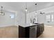 Well-lit open concept kitchen with island, dishwasher and view of living room at 2337 E Main St, Durham, NC 27703