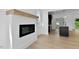 Living room view shows fireplace and kitchen island with pendant lighting at 2337 E Main St, Durham, NC 27703