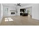 Bright living room boasts an open floorplan, fireplace, and abundant natural light at 2337 E Main St, Durham, NC 27703