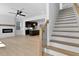 Living room view showcases fireplace and new staircase with wood treads at 2337 E Main St, Durham, NC 27703