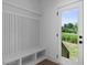 Bright mudroom boasts white millwork, custom storage, and easy access to the outdoors at 2337 E Main St, Durham, NC 27703
