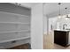 Walk-in pantry with custom shelving for ample storage in this home at 2337 E Main St, Durham, NC 27703