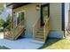 Exterior of home with wood stairs that lead to the backyard at 2337 E Main St, Durham, NC 27703