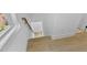 Staircase with hardwood floors, white walls, and a modern railing, providing a stylish transition at 2337 E Main St, Durham, NC 27703