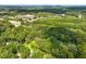 Aerial view of property near a lake and shopping center at 3015 Old Raleigh Rd, Apex, NC 27502