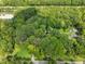 Aerial view of property, showing house and wooded lot at 3015 Old Raleigh Rd, Apex, NC 27502