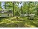 Spacious backyard with trees, shed and playset at 3015 Old Raleigh Rd, Apex, NC 27502