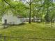 Large backyard with detached garage, playset, and picnic table at 3015 Old Raleigh Rd, Apex, NC 27502