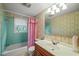 Bathroom with vintage tile, pink shower curtain and wood vanity at 3015 Old Raleigh Rd, Apex, NC 27502