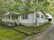 White ranch house with a front porch and side yard at 3015 Old Raleigh Rd, Apex, NC 27502