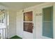 Front door entry with teal shutters and storm door at 3015 Old Raleigh Rd, Apex, NC 27502