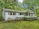 White house with blue shutters and a covered porch at 3015 Old Raleigh Rd, Apex, NC 27502
