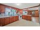 View of kitchen with wood cabinets and appliances at 3015 Old Raleigh Rd, Apex, NC 27502