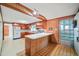 Kitchen with wood cabinets and a breakfast bar at 3015 Old Raleigh Rd, Apex, NC 27502