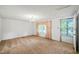 Living room with carpet, curtains, and door to porch at 3015 Old Raleigh Rd, Apex, NC 27502