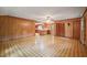 Spacious living room with wood paneling and tile floors at 3015 Old Raleigh Rd, Apex, NC 27502