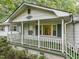 Front porch detail with white railings and columns at 3015 Old Raleigh Rd, Apex, NC 27502
