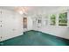 Sunroom with green carpet, ceiling fan and multiple windows at 3015 Old Raleigh Rd, Apex, NC 27502