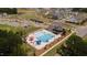 Aerial view of community pool, clubhouse, and playground at 553 Eversden Dr, Zebulon, NC 27597