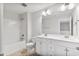 Bright bathroom featuring a double vanity with white countertops and a shower-tub combination at 553 Eversden Dr, Zebulon, NC 27597