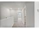 Carpeted hallway with a recessed light and white wall and door trim at 553 Eversden Dr, Zebulon, NC 27597