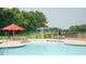 Water feature and splash pad in a well-maintained community pool area at 553 Eversden Dr, Zebulon, NC 27597