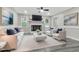 Bright living room features a fireplace, comfy seating, and hardwood floors at 116 Oak Ridge Dr, Willow Springs, NC 27592