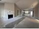 Open living room featuring a white shiplap fireplace and kitchen at 614 Tuscany Cir, Princeton, NC 27569