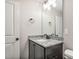 Bathroom showcasing granite vanity, decorative mirror, lighting, and gray walls at 258 Thistle Ct, Sanford, NC 27332