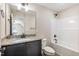 Bathroom featuring granite vanity, sink, shower-tub combination, and tile flooring at 258 Thistle Ct, Sanford, NC 27332