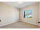 Cozy bedroom with carpeted floor, a window, and neutral paint at 258 Thistle Ct, Sanford, NC 27332