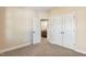 Bedroom featuring carpeted floor, a closet, and neutral paint at 258 Thistle Ct, Sanford, NC 27332