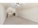 Spacious bonus room with neutral paint, carpet, ceiling fan, and an ensuite bath access at 258 Thistle Ct, Sanford, NC 27332
