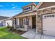 Inviting front porch with stone pillars, a cozy seating area, and attractive exterior finishes at 258 Thistle Ct, Sanford, NC 27332