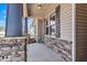 Covered porch with stone accents and view of the home's exterior, offering a cozy entryway at 258 Thistle Ct, Sanford, NC 27332