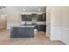 Well-lit kitchen showcasing gray cabinets, granite countertops, and stainless steel appliances at 258 Thistle Ct, Sanford, NC 27332