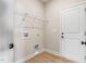 Functional laundry room with wire shelving and convenient connections at 258 Thistle Ct, Sanford, NC 27332