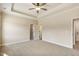 Large main bedroom featuring tray ceilings and a ceiling fan at 258 Thistle Ct, Sanford, NC 27332