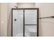 Bathroom shower enclosed by frosted glass at 258 Thistle Ct, Sanford, NC 27332