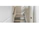 Carpeted staircase with stained wood handrail at 258 Thistle Ct, Sanford, NC 27332